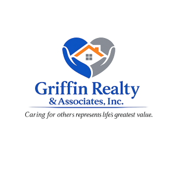 Real estate agent handing house keys to a smiling couple